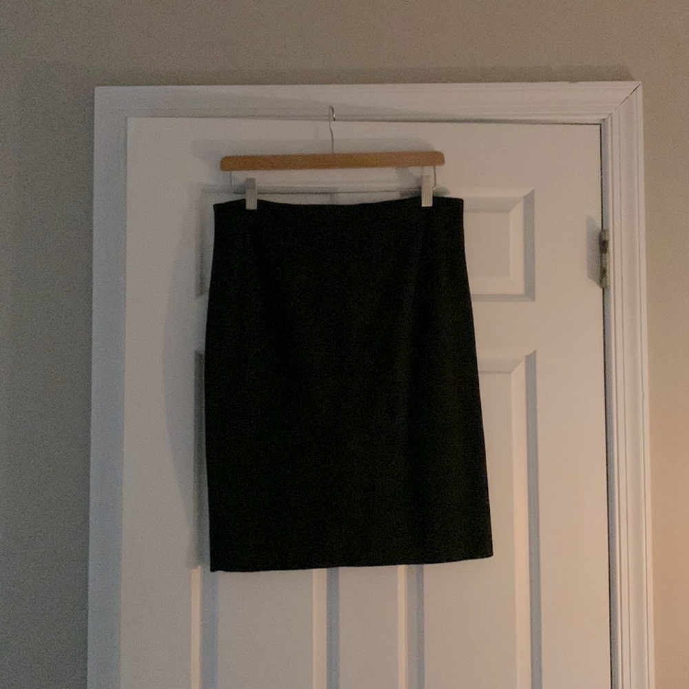 Black Elle pencil skirt with small slit in the back